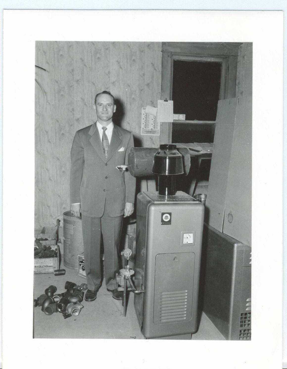 Raymond Behrmann with a radiant heat unit